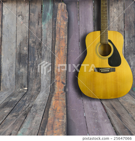 Acoustic guitar on wooden background texture Acoustic guitar on wooden background texture 25647066