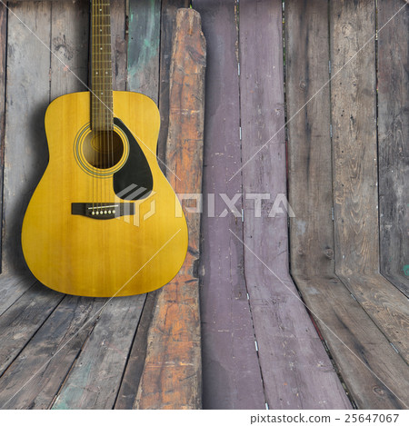 Acoustic guitar on wooden background texture Acoustic guitar on wooden background texture 25647067