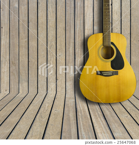 Acoustic guitar on wooden background texture Acoustic guitar on wooden background texture 25647068