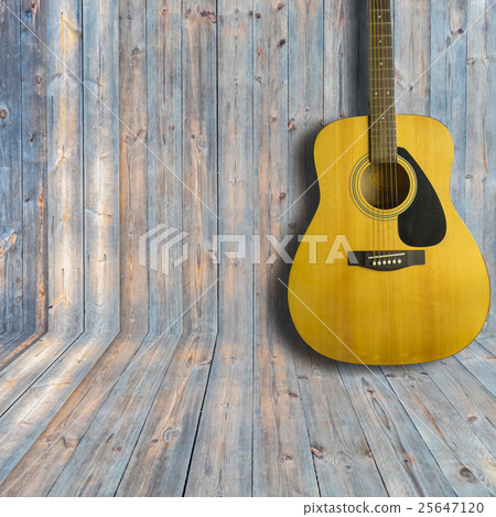Acoustic guitar on wooden background texture Acoustic guitar on wooden background texture 25647120