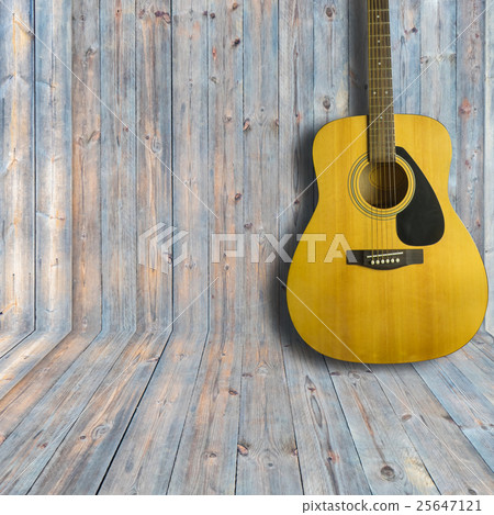 Acoustic guitar on wooden background texture 25647121