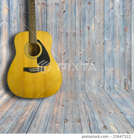 Acoustic guitar on wooden background texture Acoustic guitar on wooden background texture 25647122