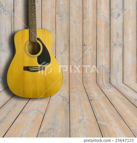 Acoustic guitar on wooden background texture Acoustic guitar on wooden background texture 25647123