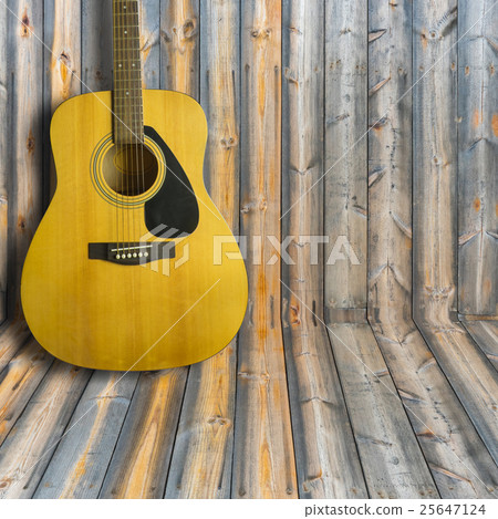 Acoustic guitar on wooden background texture Acoustic guitar on wooden background texture 25647124