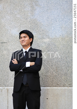 Portrait of a smiling young handsome businessman 25647131