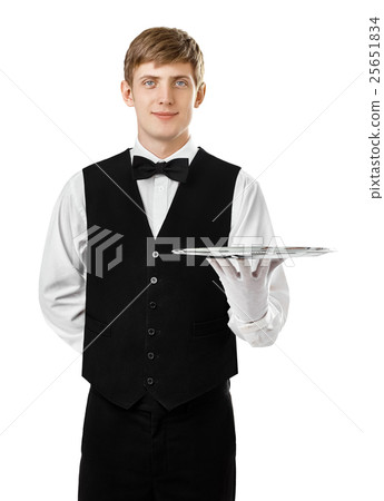 Young handsome waiter holding empty tray Young handsome waiter holding empty tray 25651834