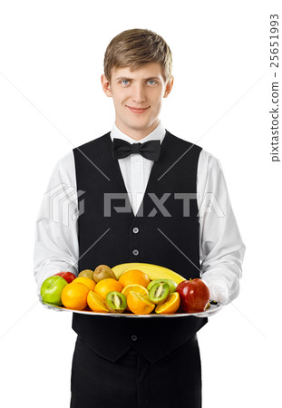 Young handsome waiter holding big tray full of fresh fruits 25651993
