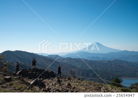 Mountain climbers looking at Mt. Fuji from the Daibosadzu Pass 25654947