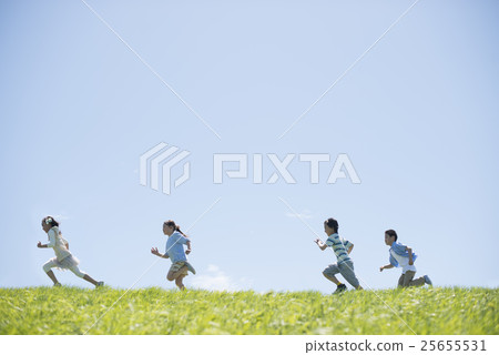 Elementary school student running on the meadow Elementary school student running on the meadow 25655531
