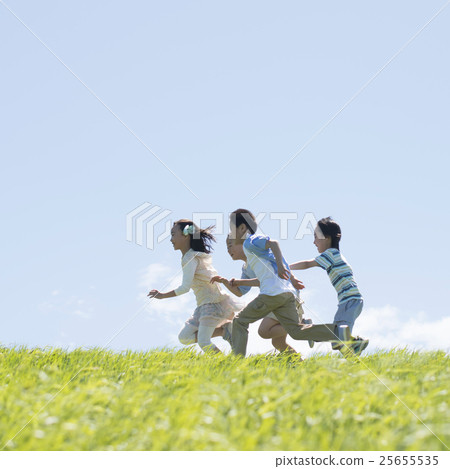 Elementary school student running on the meadow Elementary school student running on the meadow 25655535