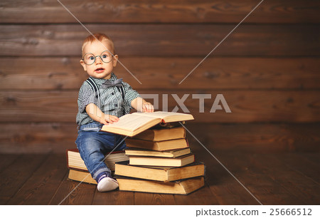 funny baby with books in glasses 25666512
