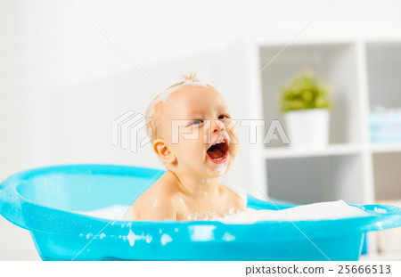 Happy toddler bathing in bathtub 25666513