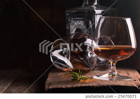 Glass of brandy or cognac and bottle Glass of brandy or cognac and bottle 25670071