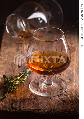Glass of brandy or cognac  25670174