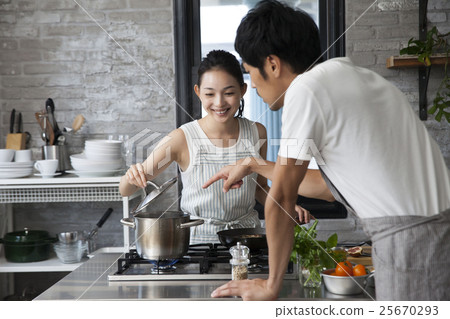 Couple doing cooking 25670293