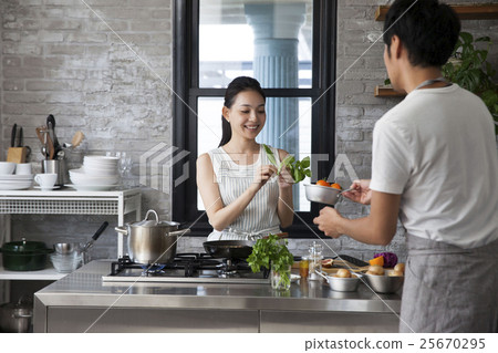Couple doing cooking 25670295