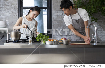Couple doing cooking 25670296