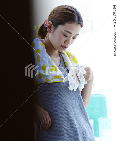 A woman looking at moving outside A woman looking at moving outside 25670894