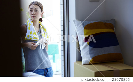 A woman looking at moving outside A woman looking at moving outside 25670895