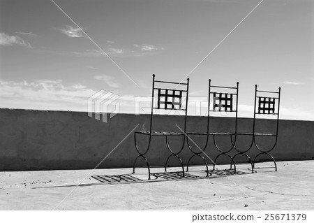 Rusty chair on a balcony Rusty chair on a balcony 25671379