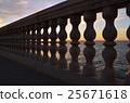 Balustrade with sunset in the sea behind 25671618