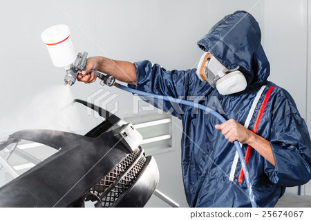 worker painting a car black blank parts in special worker painting a car black blank parts in special 25674067