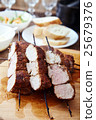 Skewered meat or shish kebabs of pork in marinade 25679376