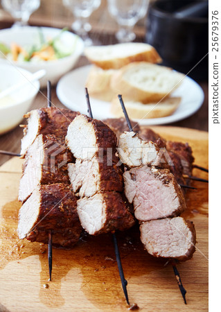 Skewered meat or shish kebabs of pork in marinade 25679376