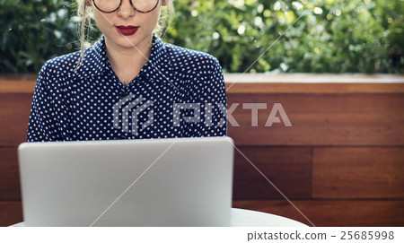 Woman Sitting Alone Using Laptop Concept 25685998
