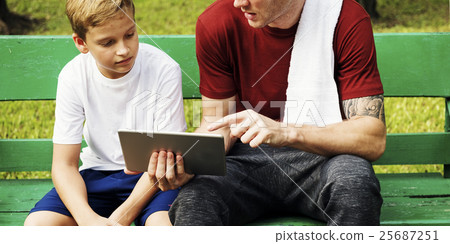 Boy Training Outdoors Exercise Tablet Concept 25687251