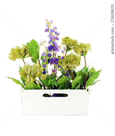 Composition of artificial garden flowers in decorative vase Composition of artificial garden flowers in decorative vase 25689620