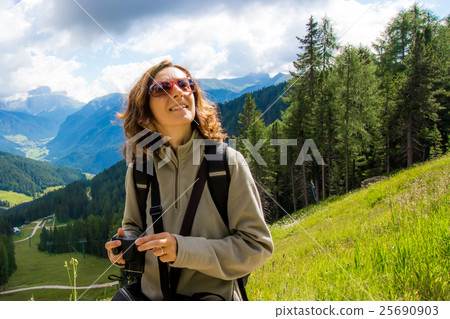 Woman looks the mountain landscape 25690903