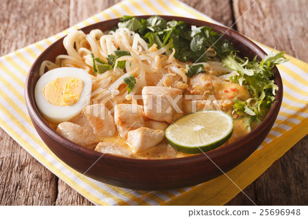 Malaysian laksa soup with chicken close up Malaysian laksa soup with chicken close up 25696948
