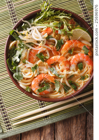 Malaysian laksa soup with prawns close up Malaysian laksa soup with prawns close up 25696976