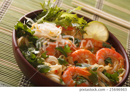 Thick soup with shrimps, noodles and herbs Thick soup with shrimps, noodles and herbs 25696983