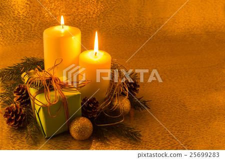 Burning white Christmas candles Burning white Christmas candles 25699283