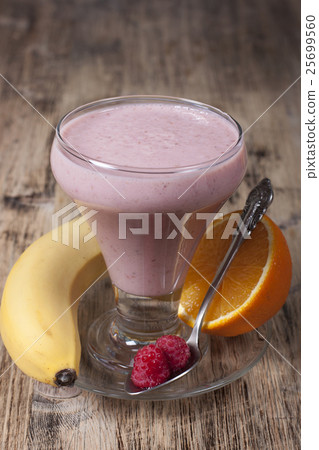 Smoothie of banana, orange juice , raspberry Smoothie of banana, orange juice , raspberry 25699560