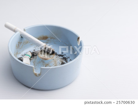 Cigarette in ashtray Cigarette in ashtray 25700630
