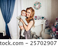 Christmas tree and happy mother with son 25702907
