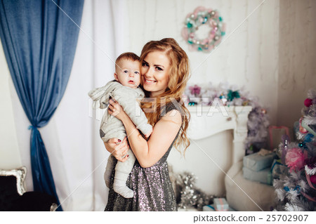 Christmas tree and happy mother with son 25702907