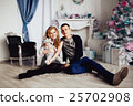 Christmas tree and happy family around 25702908