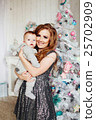Christmas tree and happy mother with son 25702909