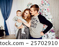 Christmas tree and happy family around 25702910