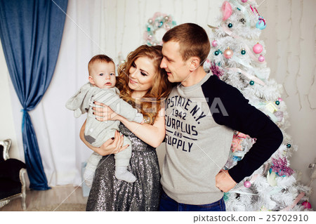 Christmas tree and happy family around 25702910