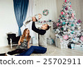Christmas tree and happy family around 25702911