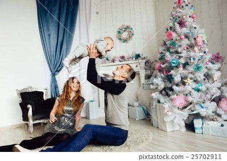 Christmas tree and happy family around 25702911