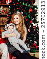 Christmas tree and happy mother with son 25702913
