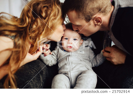 Christmas tree and happy family around 25702914