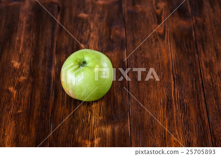 Fresh green apple on dark wooden background, copy 25705893