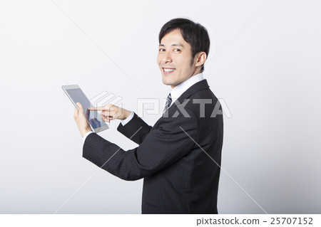 Businessmen using tablets Businessmen using tablets 25707152